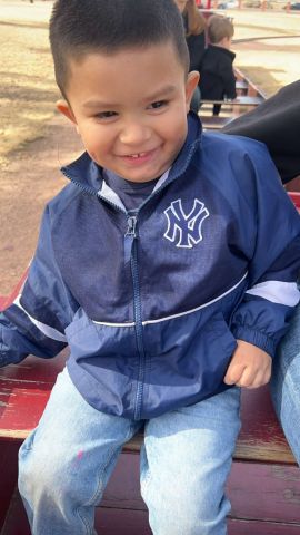 Isaiah wearing New York Yankees Jacket
