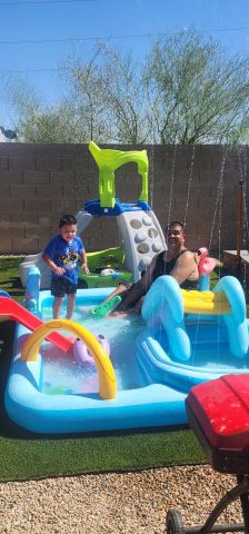 Samual & Isaiah playing in the water
